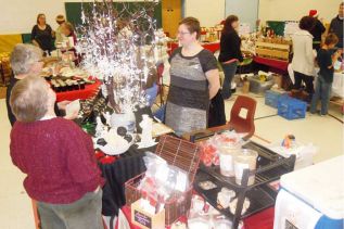 Rebecca Peters of Rebecca's Angels and Snowflakes at the 10th annual Frontenac Farmers Christmas Market at PCPS in Verona.